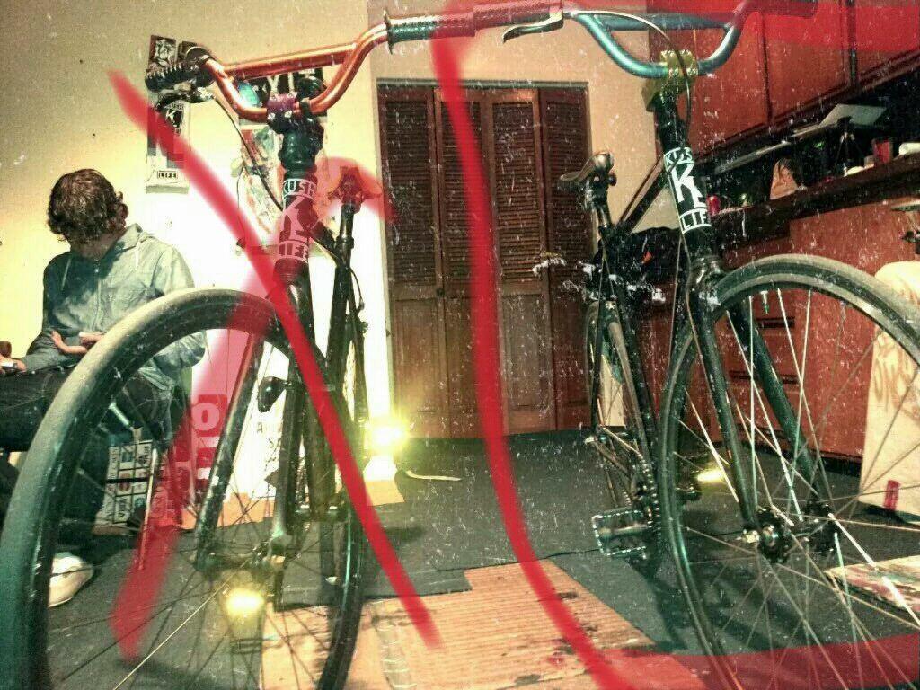 From Bikes Direct Black frame, many small white paint spots, Flip Flop with Blue/Green Handlebars now without front Wheel.  Black