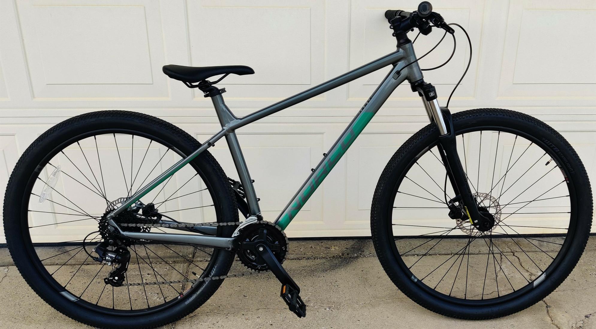 2023 Norco Bikes Storm 4 Silver, gray or bare metal and Green