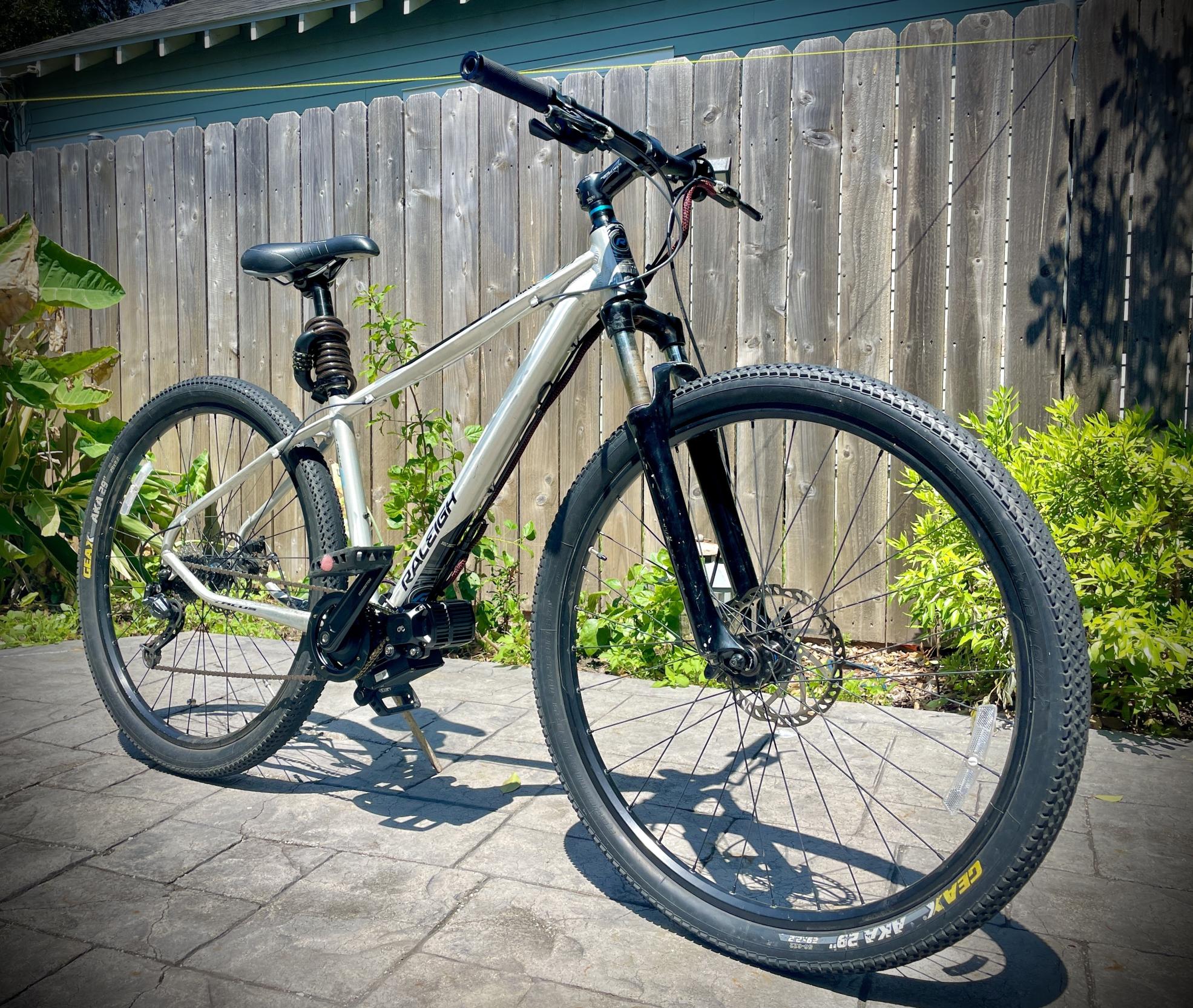 2012 Raleigh Talus 29 Silver, gray or bare metal and Blue