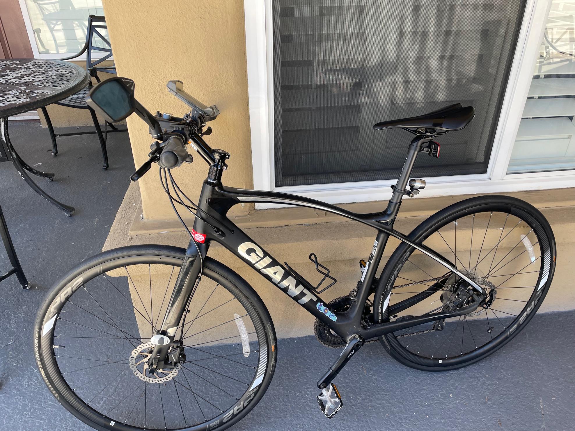 2017 Giant mens medium Black, Silver, gray or bare metal, and Stickers tape or other cover-up